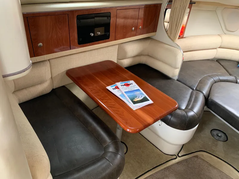 Slide: The Image of Interior of 2006 Monterey 302 Cruiser with wooden table and comfortable seating. - 10