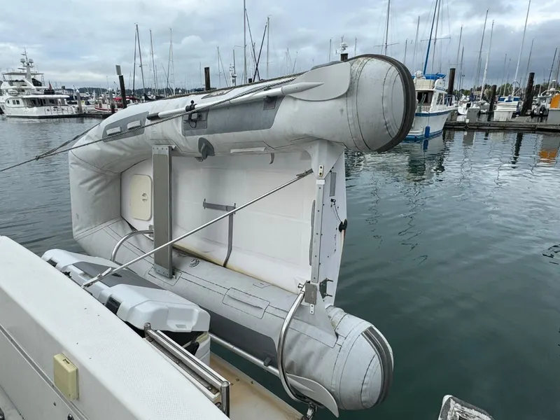Slide: The Image of Inflatable boat on a 2005 Bayliner 288 Classic, docked at a marina. - 16