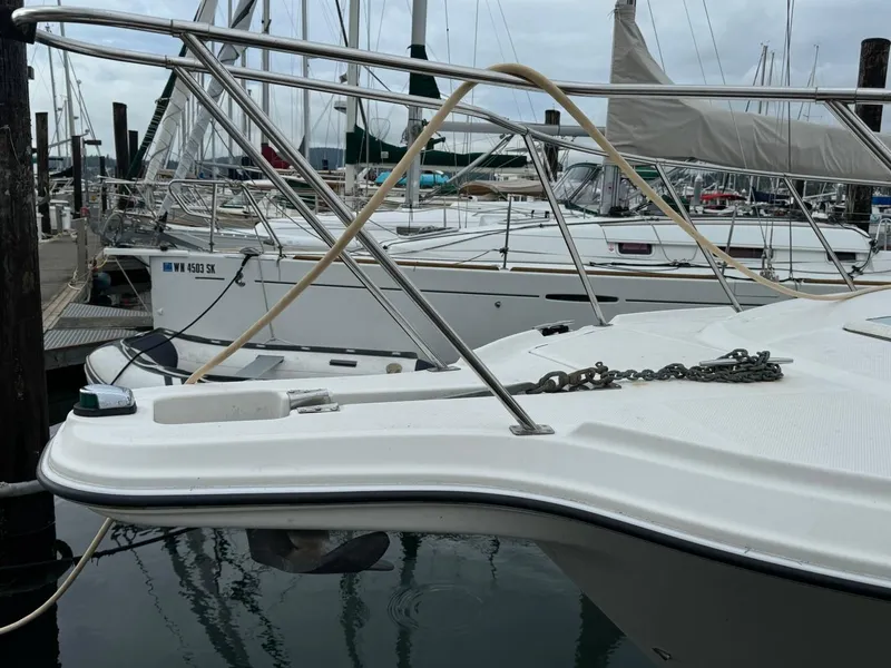 Slide: The Image of 2005 Bayliner 288 Classic boat docked in a marina. - 17