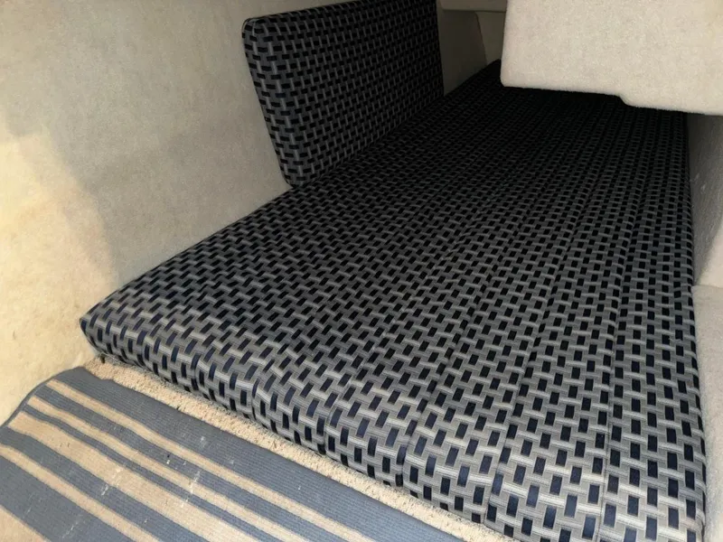 Slide: The Image of Interior cabin of 2005 Bayliner 288 Classic with patterned upholstery. - 5