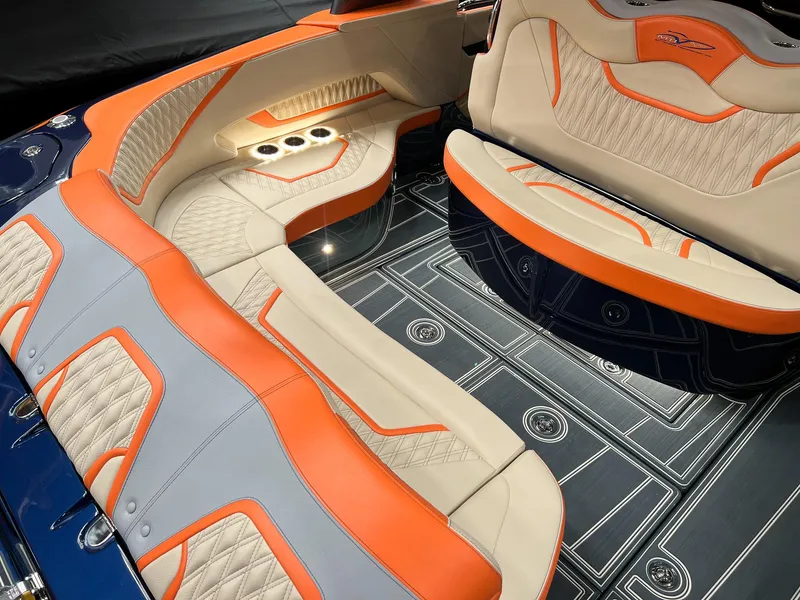 Slide: The Image of Luxurious interior of 2024 MTI V42 boat with orange and beige seating. - 17