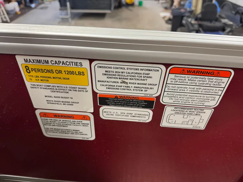 Slide: The Image of Capacity and warning labels on 2025 Sun Tracker Bass Buggy 18 DLX boat. - 4
