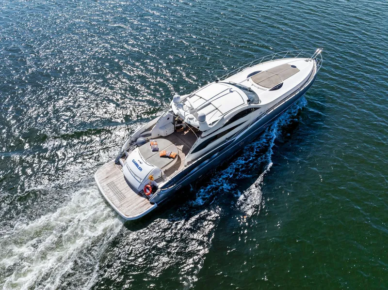 Slide: The Image of Sunseeker Predator 75 yacht cruising on open water, aerial view, 2001 model. - 0
