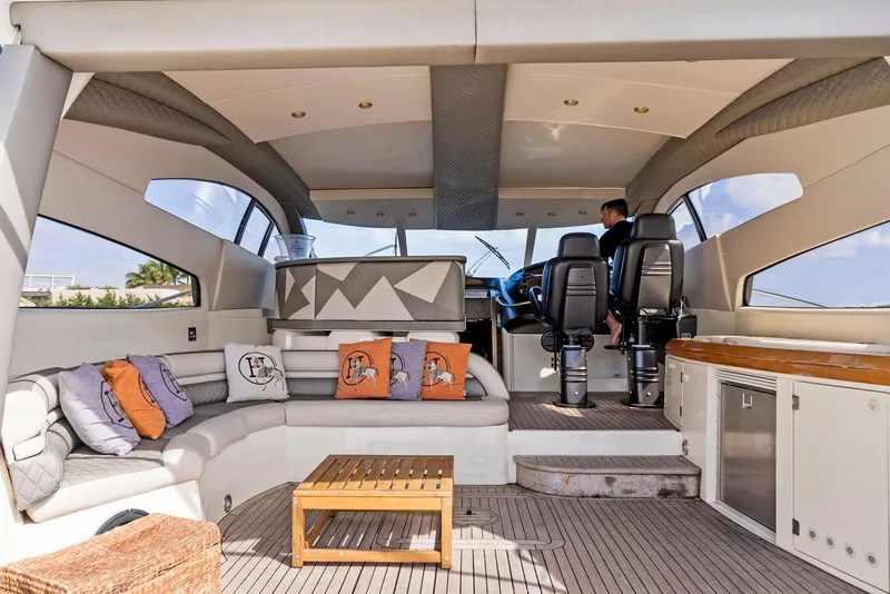 Slide: The Image of Luxurious interior of 2001 Sunseeker Predator 75 yacht with modern seating and helm. - 11