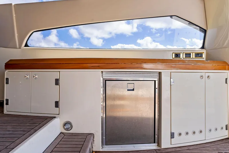 Slide: The Image of Sunseeker Predator 75 yacht interior, 2001 model, featuring sleek cabinetry and modern design. - 14