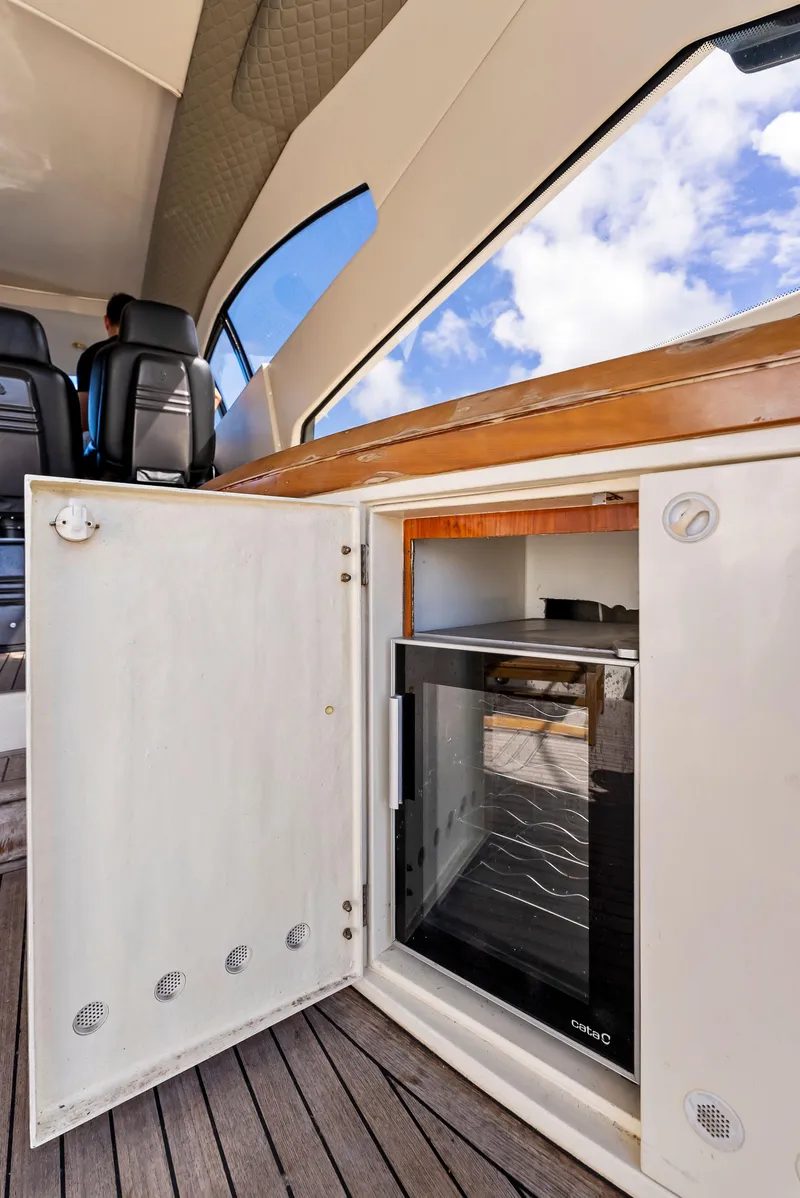 Slide: The Image of Sunseeker Predator 75 yacht interior with open mini fridge, 2001 model. - 15
