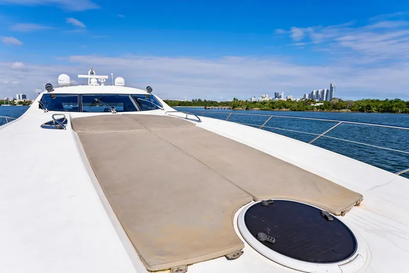 Slide: The Image of Sunseeker Predator 75 yacht deck, 2001 model, cruising on a sunny day with city skyline. - 18