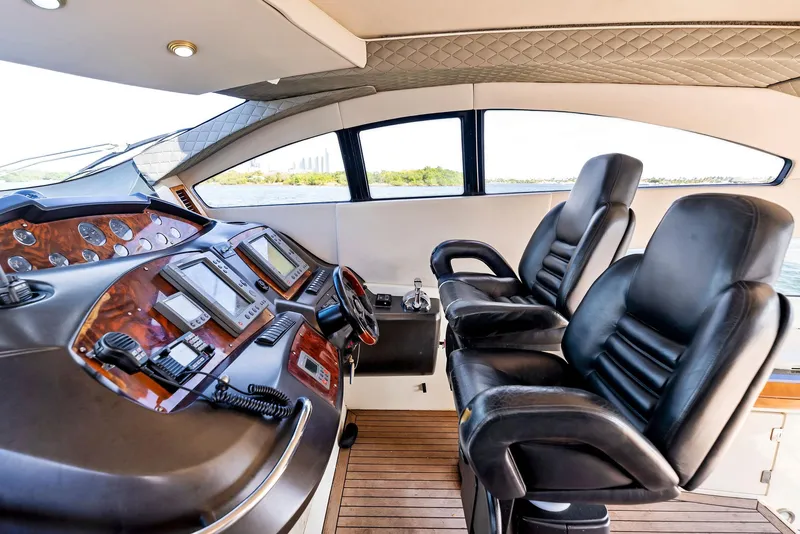 Slide: The Image of Luxurious 2001 Sunseeker Predator 75 yacht cockpit with leather seats and advanced controls. - 20