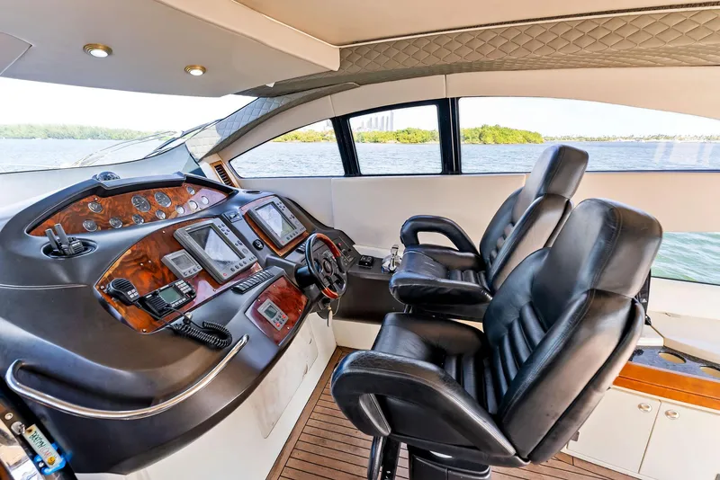 Slide: The Image of Interior helm of 2001 Sunseeker Predator 75 yacht with leather seats and control panel. - 21