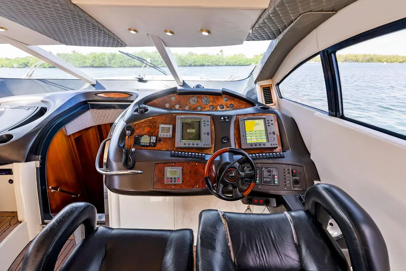 Slide: The Image of Luxurious 2001 Sunseeker Predator 75 yacht cockpit with advanced navigation controls. - 22