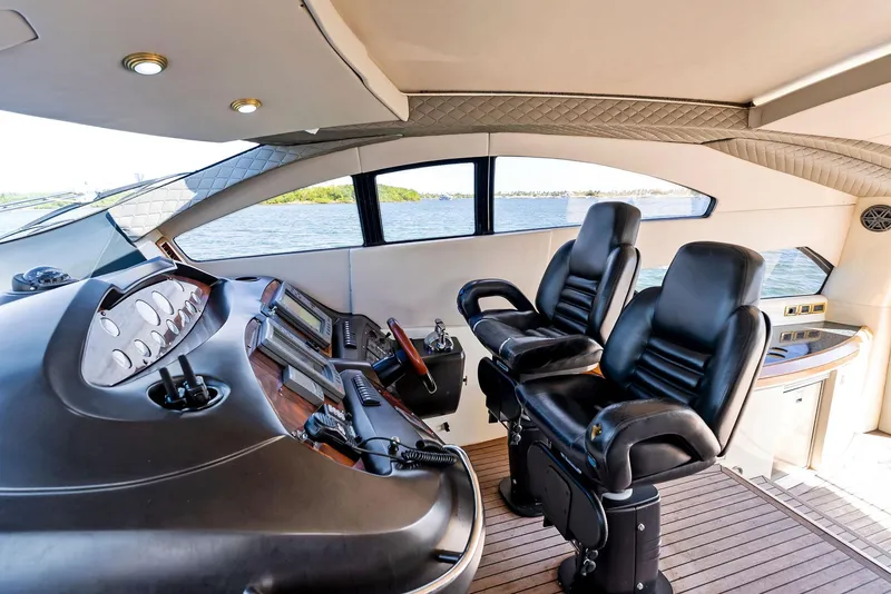 Slide: The Image of Luxurious 2001 Sunseeker Predator 75 yacht interior with leather seats and modern controls. - 23