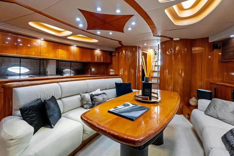 Slide: The Image of Luxurious interior of 2001 Sunseeker Predator 75 yacht with elegant wood finishes and plush seating. - 27