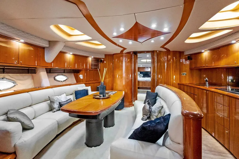 Slide: The Image of Luxurious interior of 2001 Sunseeker Predator 75 yacht with elegant wood finishes and plush seating. - 30