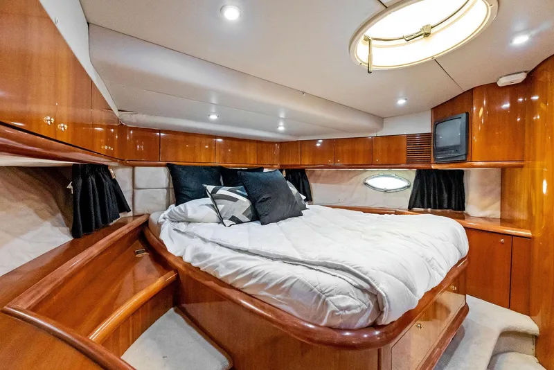 Slide: The Image of Luxurious cabin interior of 2001 Sunseeker Predator 75 yacht with wood finish and cozy bed. - 36