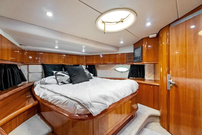 Slide: The Image of Luxurious cabin interior of 2001 Sunseeker Predator 75 yacht with elegant wood finish. - 37