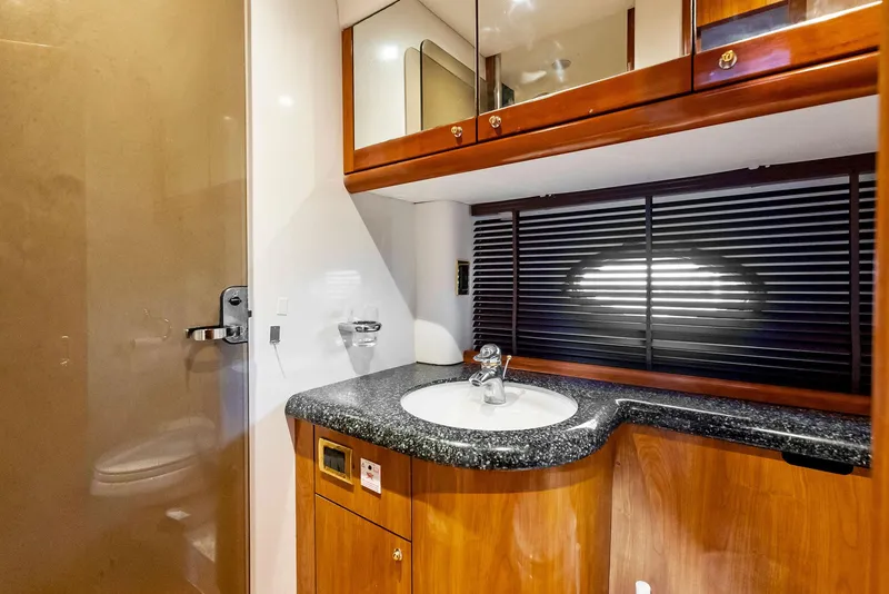 Slide: The Image of Luxurious bathroom in 2001 Sunseeker Predator 75 yacht with sleek wood cabinetry. - 41
