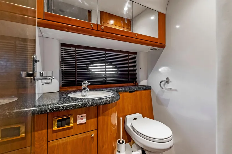 Slide: The Image of Luxurious bathroom in 2001 Sunseeker Predator 75 yacht with wood cabinetry and modern fixtures. - 42