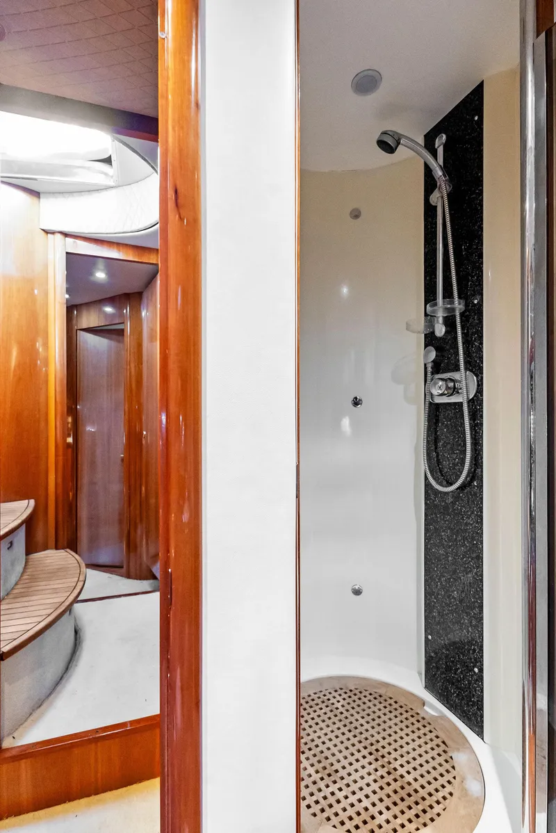 Slide: The Image of Luxurious 2001 Sunseeker Predator 75 yacht interior with modern shower and wooden accents. - 44