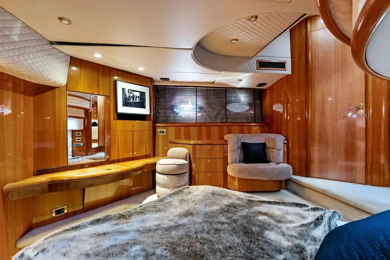 Slide: The Image of Luxurious interior of 2001 Sunseeker Predator 75 yacht with wood paneling and plush seating. - 48