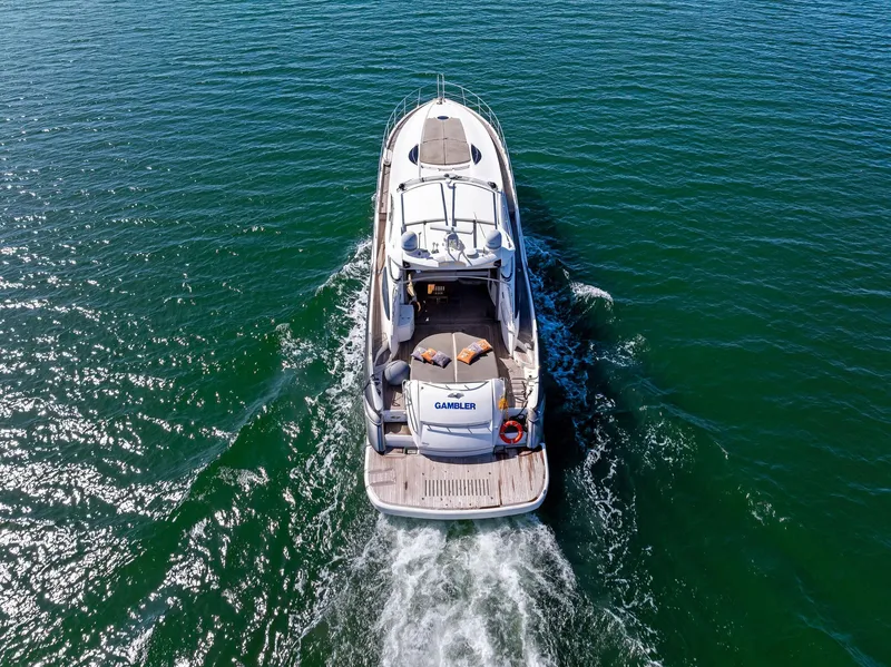 Slide: The Image of Sunseeker Predator 75 yacht cruising on open water, aerial view, 2001 model. - 6