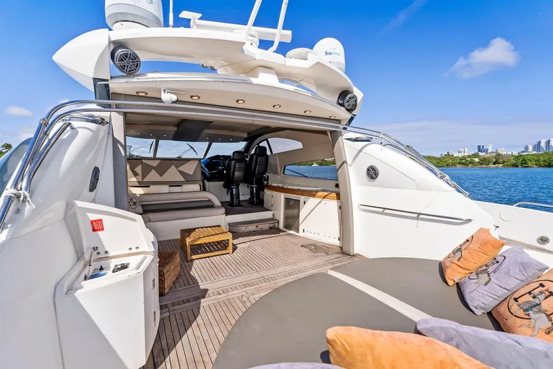 Slide: The Image of Luxurious 2001 Sunseeker Predator 75 yacht interior with plush seating and scenic water view. - 7