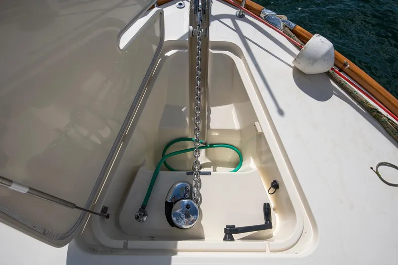 Slide: The Image of Anchor locker of 2006 Hinckley Talaria 44 FB yacht with chain and hose. - 12