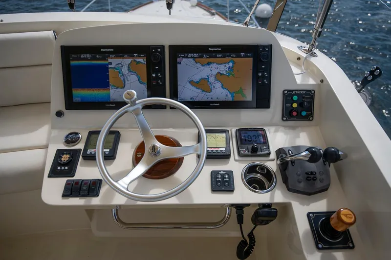 Slide: The Image of Helm of 2006 Hinckley Talaria 44 FB with navigation screens and controls. - 20