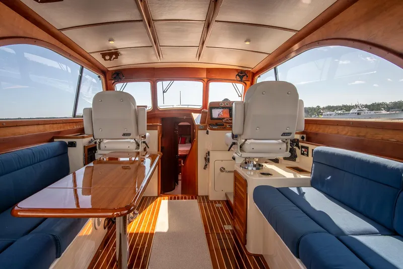 Slide: The Image of Interior of 2006 Hinckley Talaria 44 FB yacht with elegant seating and wooden finishes. - 25