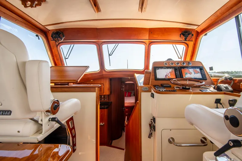 Slide: The Image of 2006 Hinckley Talaria 44 FB yacht interior with navigation equipment and luxurious seating. - 29