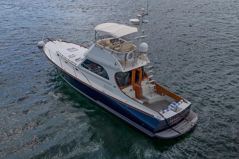 Slide: The Image of 2006 Hinckley Talaria 44 FB yacht cruising on open water. - 5