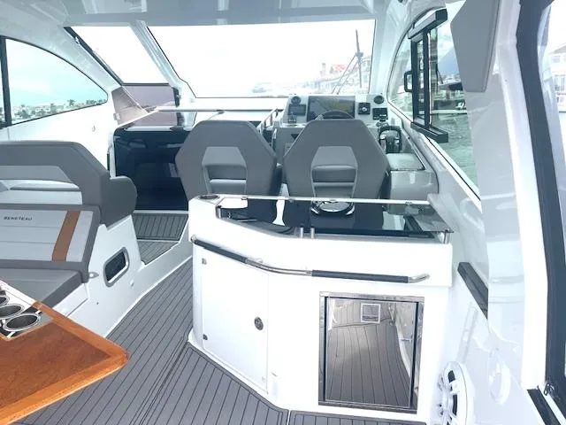 Slide: The Image of Interior of 2022 Beneteau 32 Gran Turismo yacht with modern seating and sleek design. - 15