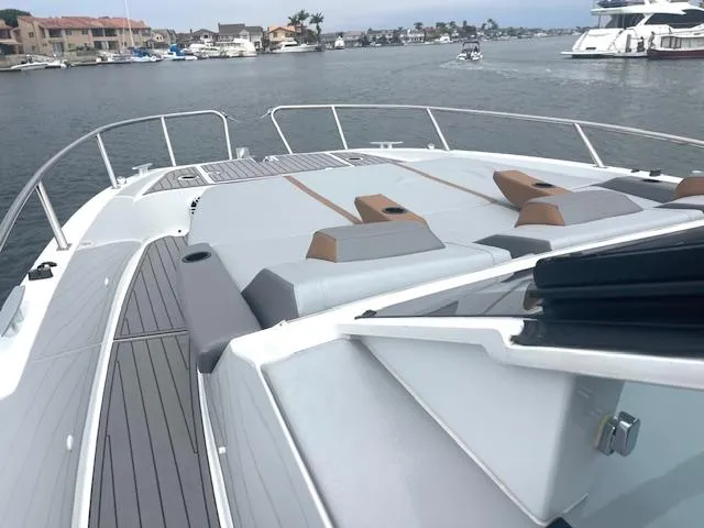 Slide: The Image of 2022 Beneteau 32 Gran Turismo yacht with sleek deck design in a marina setting. - 17