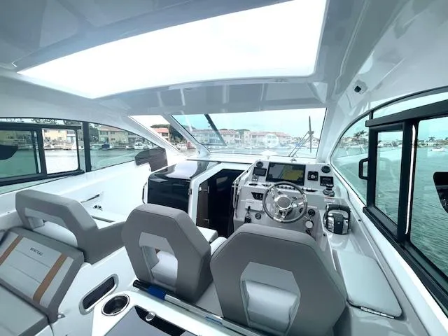 Slide: The Image of Interior of 2022 Beneteau 32 Gran Turismo yacht with modern helm and seating. - 23