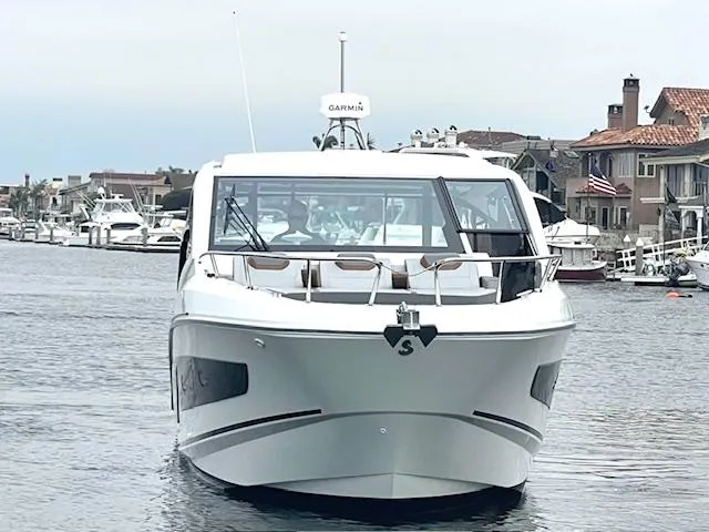 Slide: The Image of 2022 Beneteau 32 Gran Turismo yacht on calm water, front view. - 29