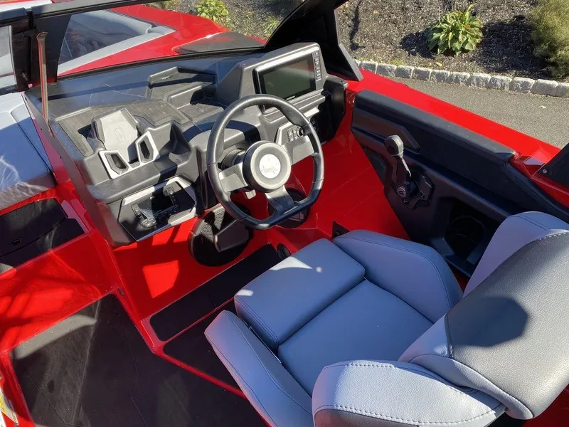 Slide: The Image of 2025 Axis A225 boat interior with modern dashboard and comfortable seating. - 10