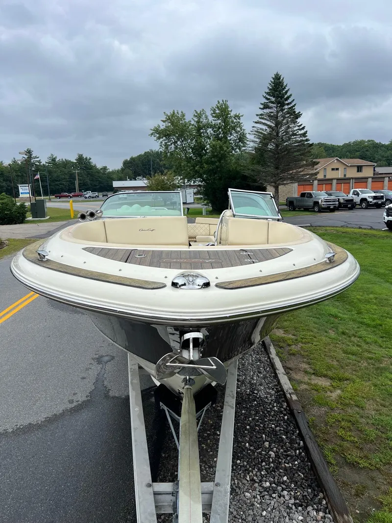 Slide: The Image of 2014 Chris-Craft 32 Launch boat on trailer, parked on roadside. - 13