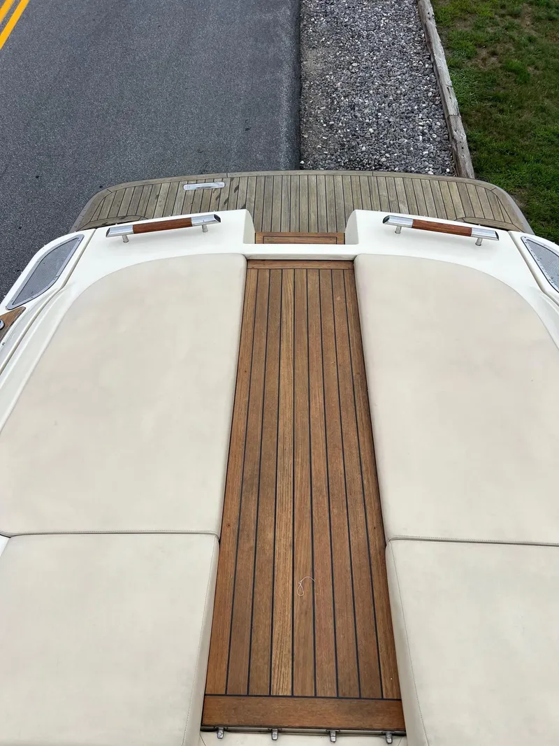 Slide: The Image of 2014 Chris-Craft 32 Launch boat with teak deck and cushioned seating. - 18