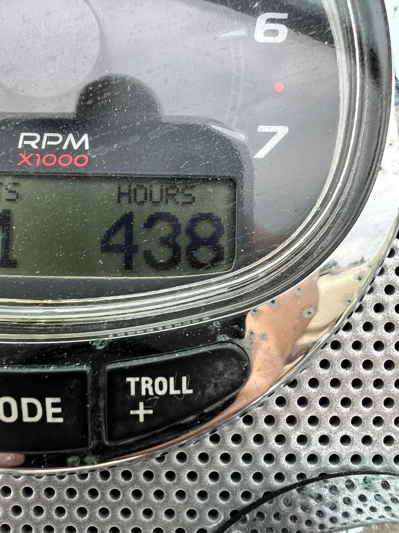 Slide: The Image of Close-up of a 2014 Chris-Craft 32 Launch engine hour meter showing 438 hours. - 3