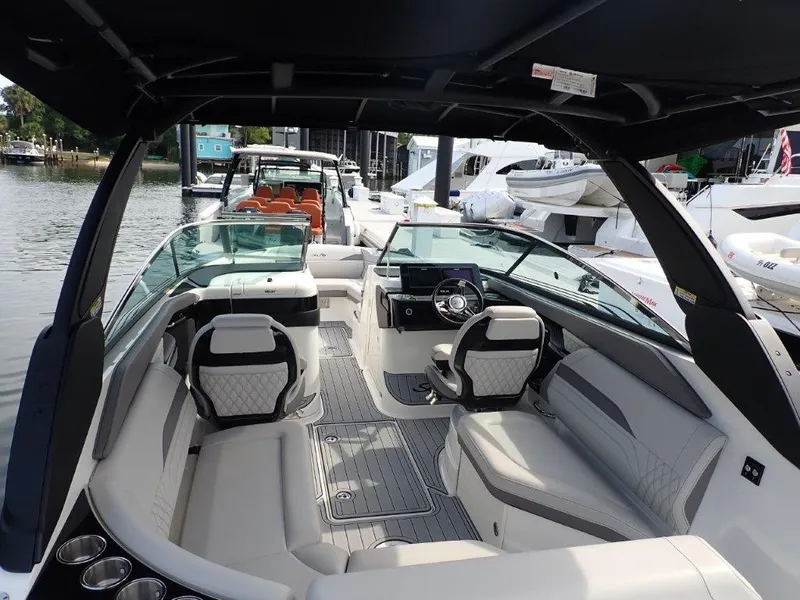 Slide: The Image of 2024 Sea Ray SLX 260 Outboard luxury boat interior with modern seating and sleek design. - 10