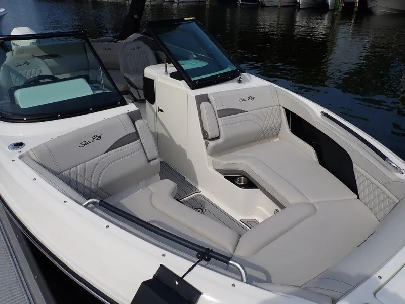 Slide: The Image of 2024 Sea Ray SLX 260 Outboard boat with luxurious seating and sleek design. - 12