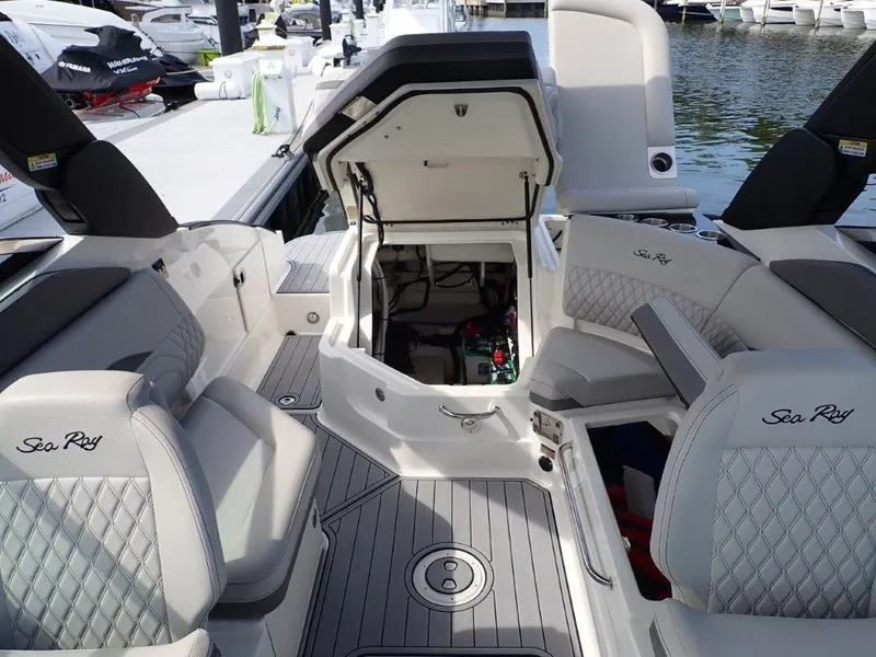 Slide: The Image of 2024 Sea Ray SLX 260 Outboard interior with luxurious seating and open engine compartment. - 14