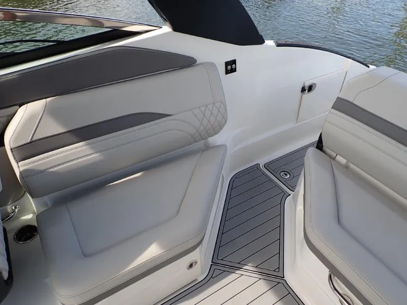 Slide: The Image of 2024 Sea Ray SLX 260 Outboard interior with sleek seating and modern design. - 19