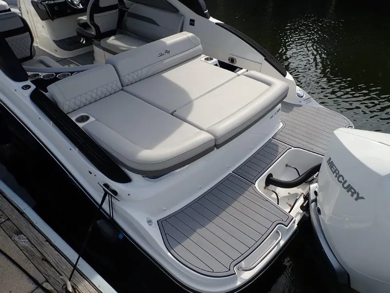 Slide: The Image of 2024 Sea Ray SLX 260 Outboard boat with spacious seating and Mercury engine. - 21