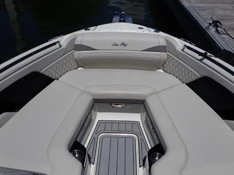 Slide: The Image of 2024 Sea Ray SLX 260 Outboard boat with luxurious seating and sleek design. - 7