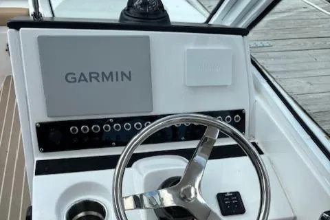 Slide: The Image of 2023 Edgewater 230 CX boat dashboard with Garmin navigation system. - 8