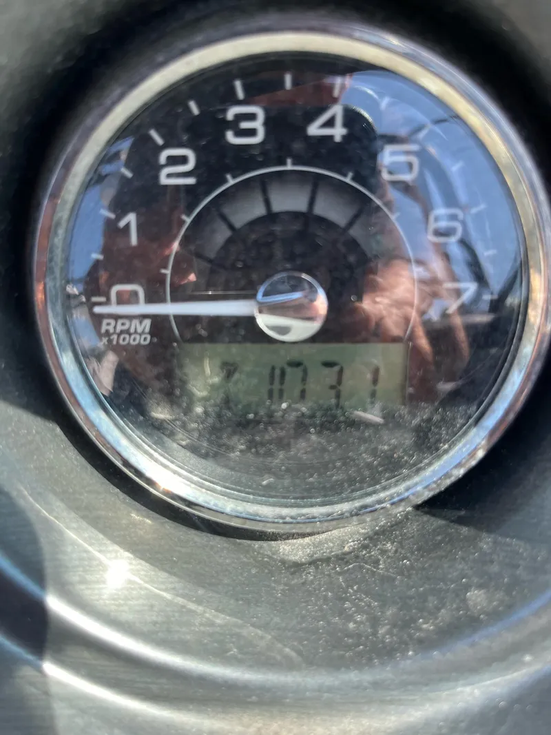 Slide: The Image of Close-up of a 2018 Monterey 238 Surf tachometer displaying 703.1 hours. - 7