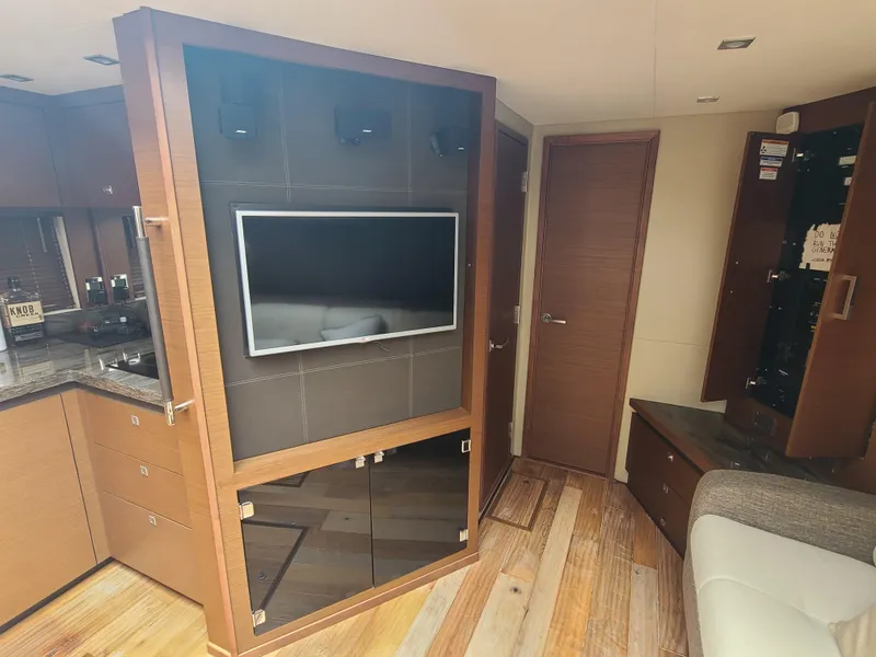 Slide: The Image of Interior of 2014 Sea Ray 510 Sundancer yacht with TV and modern wood finishes. - 10