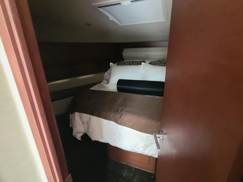 Slide: The Image of Luxurious bedroom interior of 2014 Sea Ray 510 Sundancer yacht with cozy bedding. - 11