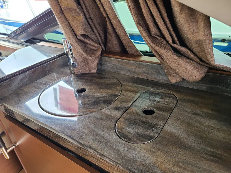 Slide: The Image of Luxurious interior of 2014 Sea Ray 510 Sundancer yacht with elegant countertop and sink. - 7