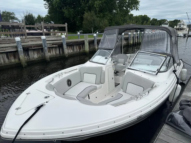 Slide: The Image of 2020 Sea Fox 226 Traveler boat docked, featuring sleek design and comfortable seating. - 2